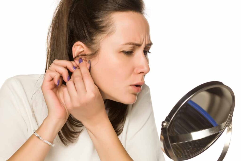 How do earring backings get stuck inside the earlobe